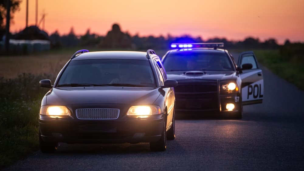 Highway Traffic Patrol Car Pulls over Vehicle Check on Empty Road.